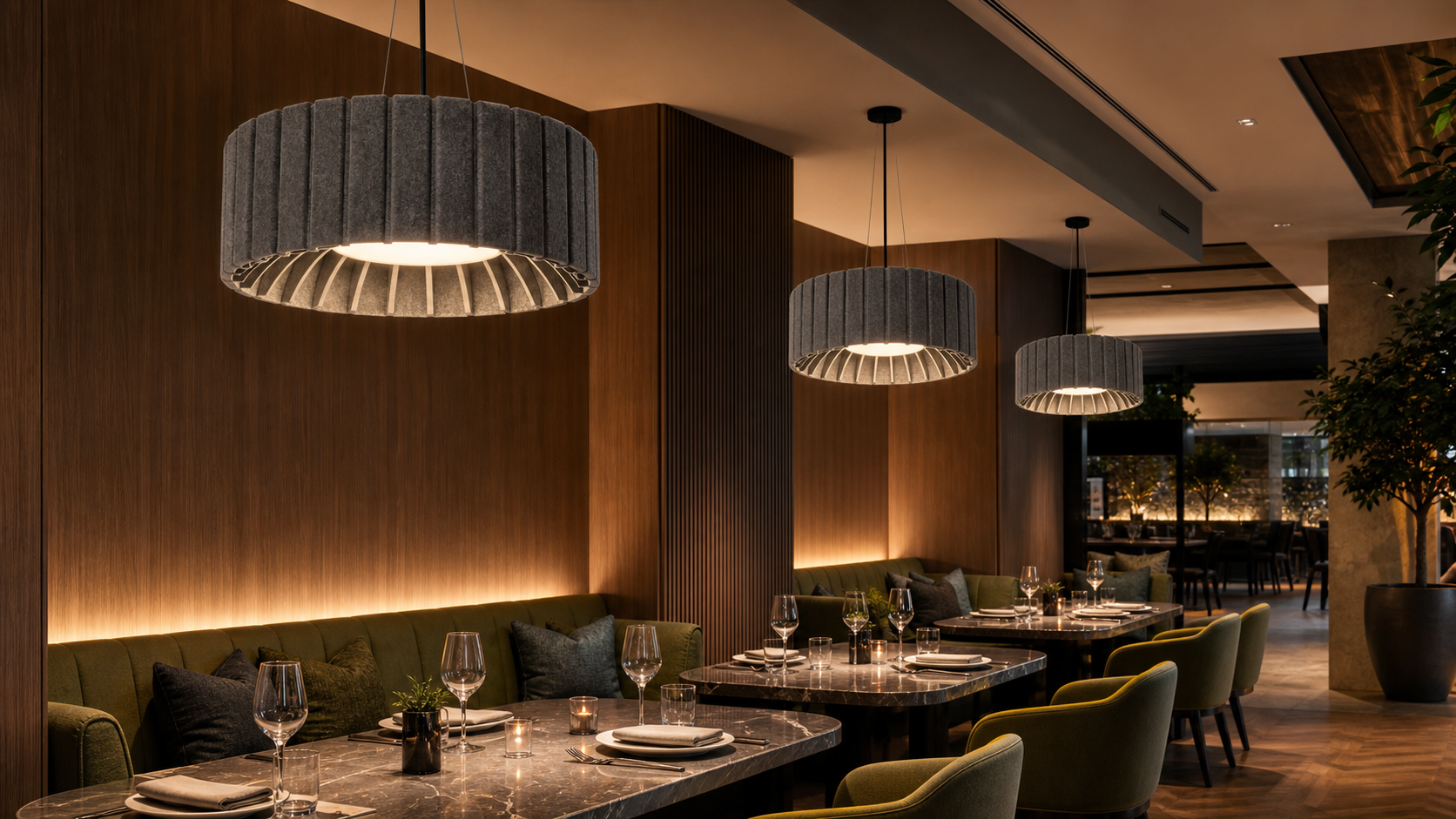 Upscale restaurant with KO-XYM-0185 slatted drum acoustic pendant lights above banquette tables